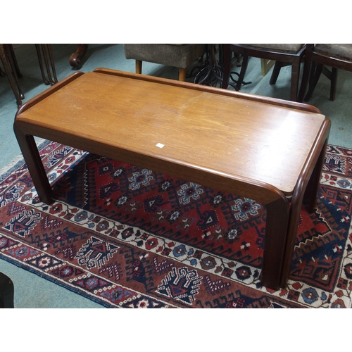 172 - A mid 20th century teak wall display unit, a three drawer chest and a teak coffee table (3)