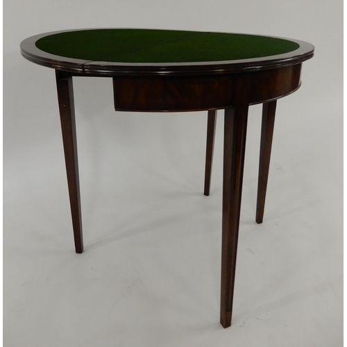 2 - A Victorian mahogany demi lune fold over card table