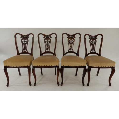 23 - A lot of four Victorian mahogany framed dining chairs with stylized backs above upholstered seats on... 