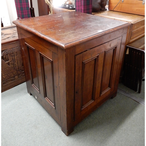 25 - A Victorian stained oak cabinet with panelled single door and sides