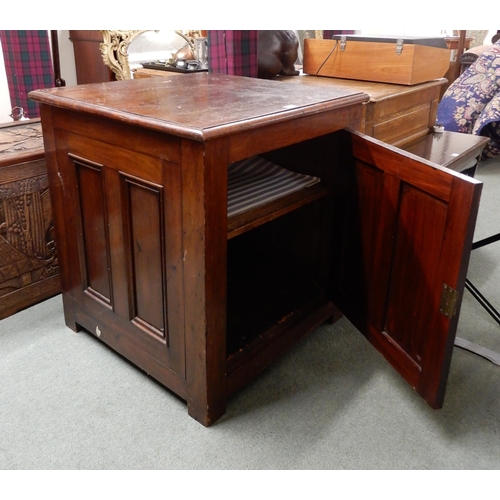 25 - A Victorian stained oak cabinet with panelled single door and sides