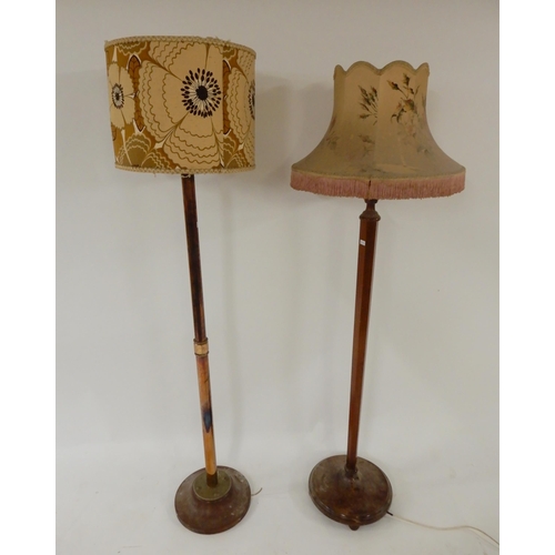 33 - An early 20th century copper and brass standard lamp and a mahogany standard lamp (2)