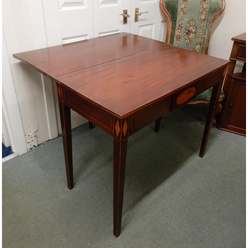 34 - A Victorian mahogany and satinwood inlaid fold over tea table