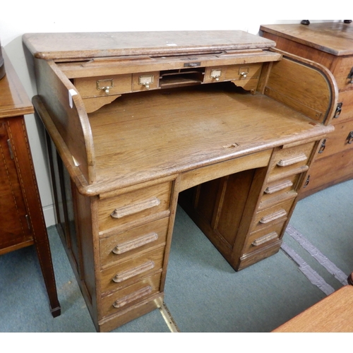 40 - A 20th century oak tambour top twin pedestal writing desk