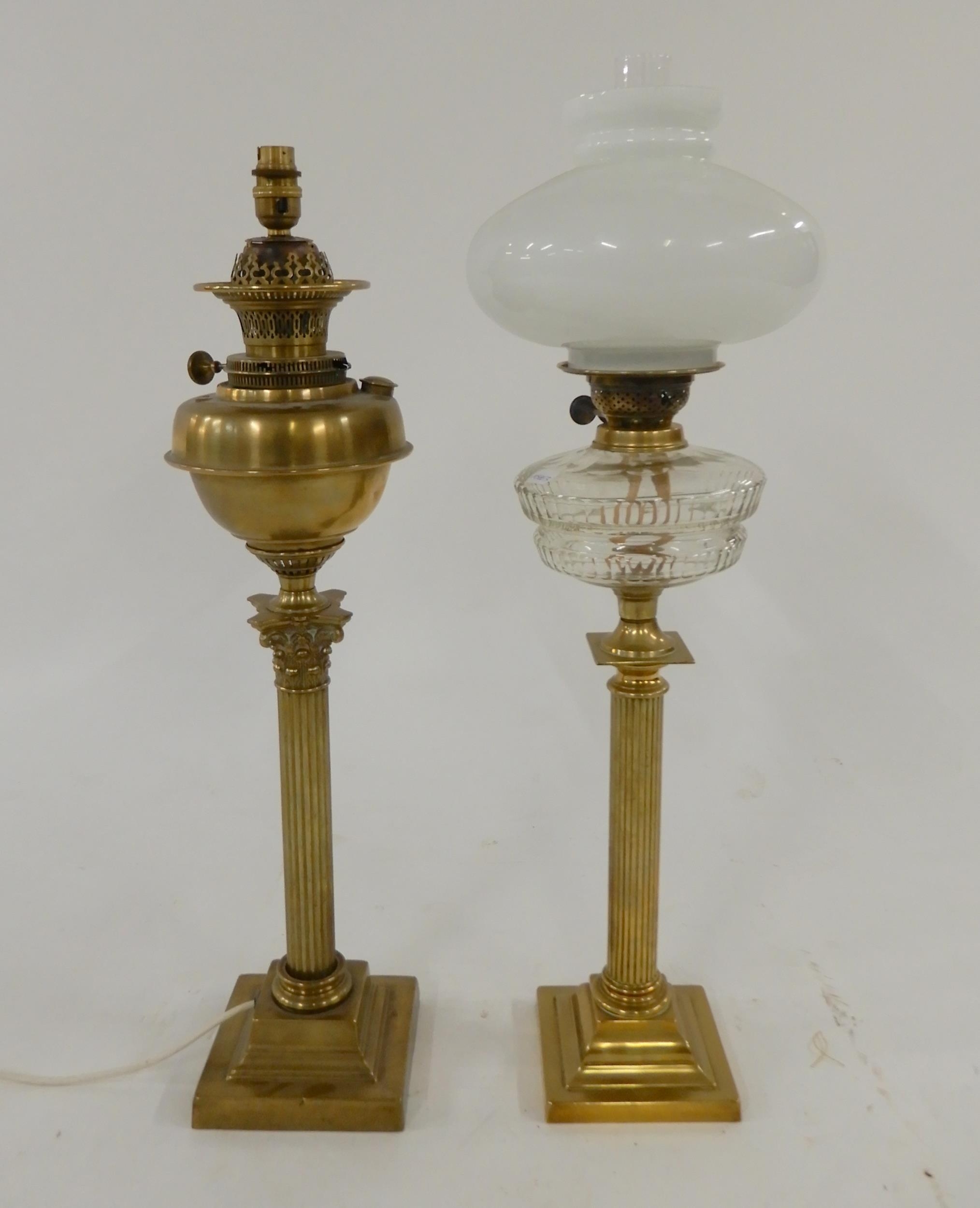 A Victorian brass oil lamp and a brass oil lamp converted to...