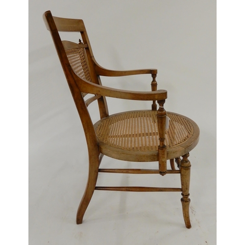 52 - A 19th century walnut and satinwood inlaid bergere armchair