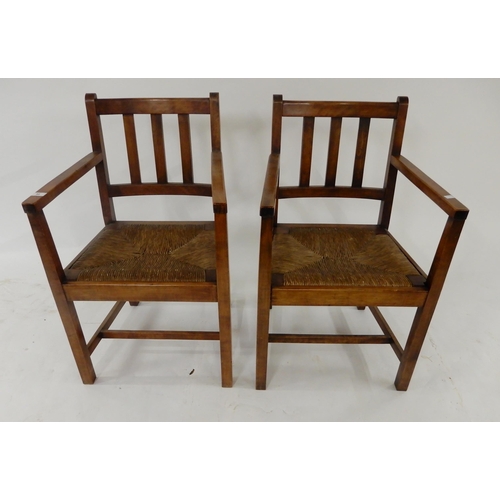 58 - A pair of 20th century rushed seat open armchairs (2)