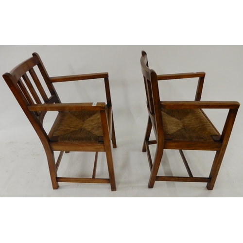 58 - A pair of 20th century rushed seat open armchairs (2)