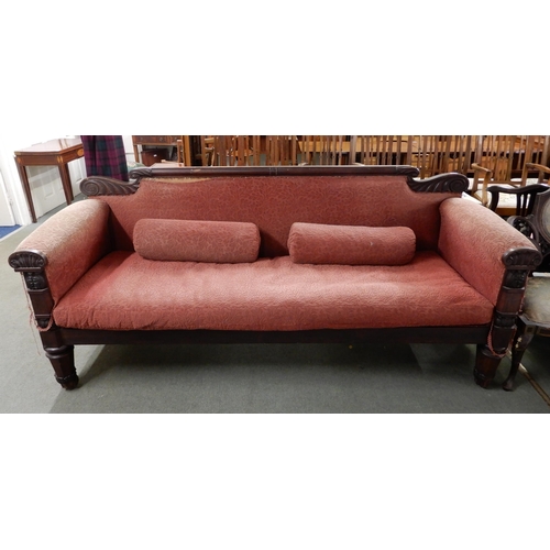 61 - A 19th century rosewood framed settee on shaped octagonal supports