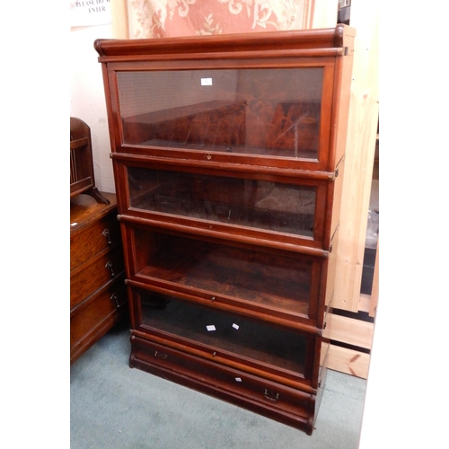 73 - A 20th century mahogany four tier sectional bookcase