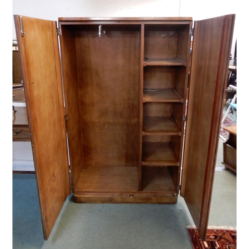 83 - A 20th century walnut veneered gents two door wardrobe