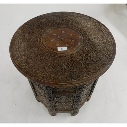 84 - A 20th century oak circular topped table with folding octagonal base