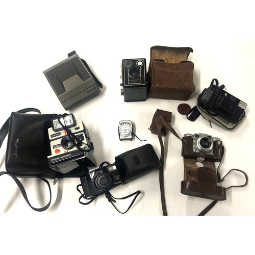 646A - A selection of vintage cameras, to include Polaroid and Paxette