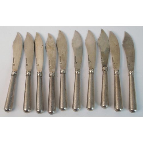 12 - A set of nine Asahi Sterling silver handled fish knives and forks