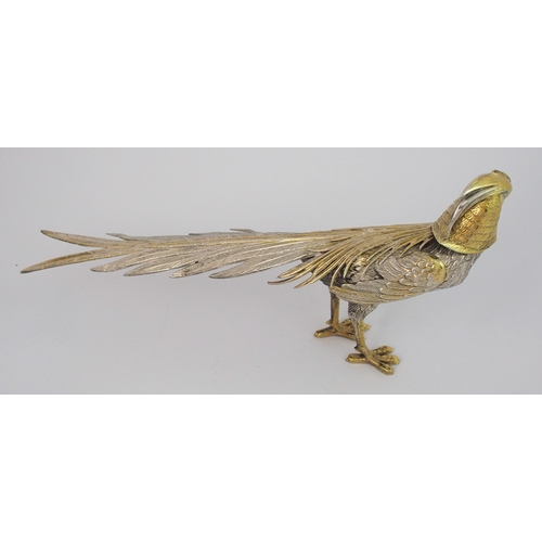 154 - A pair of Continental white metal Oriental Pheasant figures