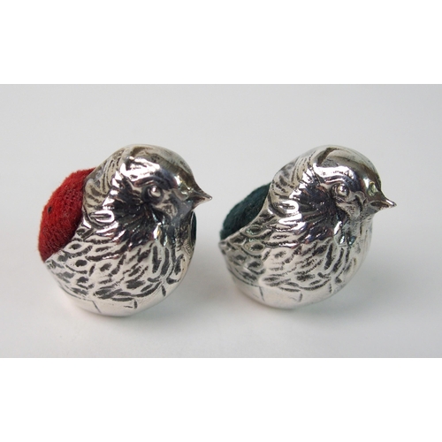 164 - A pair of novelty white metal pin cushions