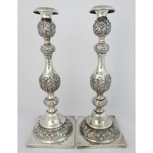 186 - A pair of silver candlesticks