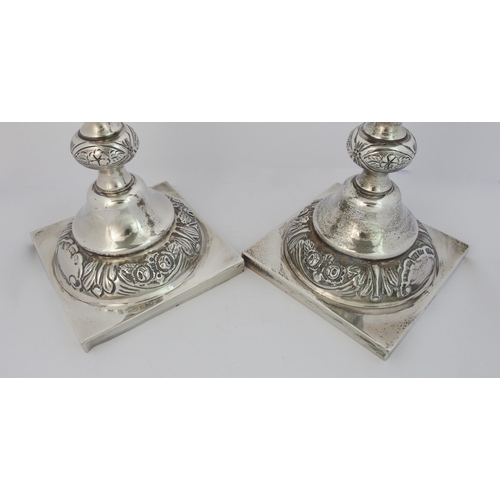 186 - A pair of silver candlesticks