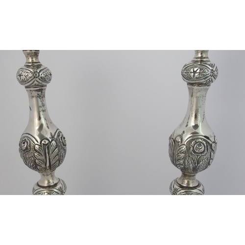 186 - A pair of silver candlesticks