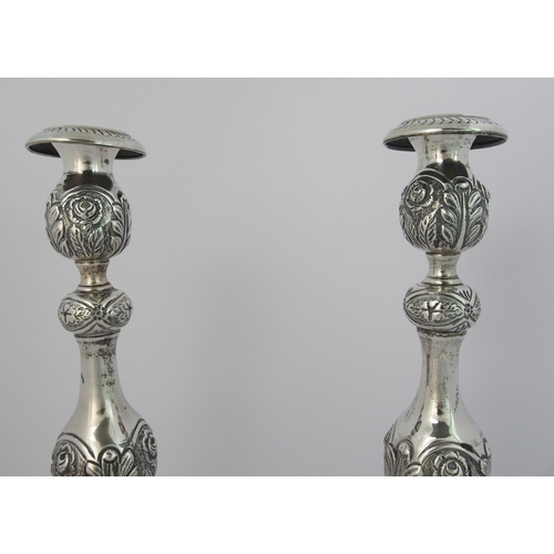 186 - A pair of silver candlesticks