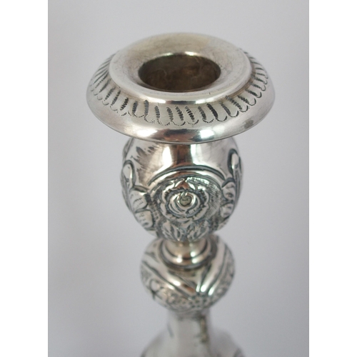 186 - A pair of silver candlesticks