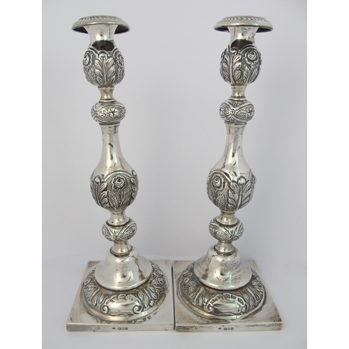 186 - A pair of silver candlesticks