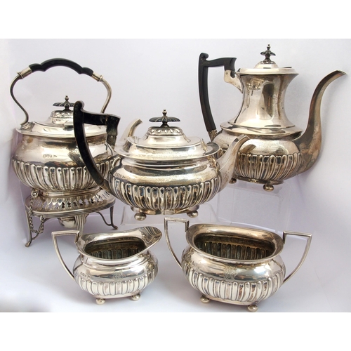 187 - A matched five piece silver tea service including spirit kettle on stand