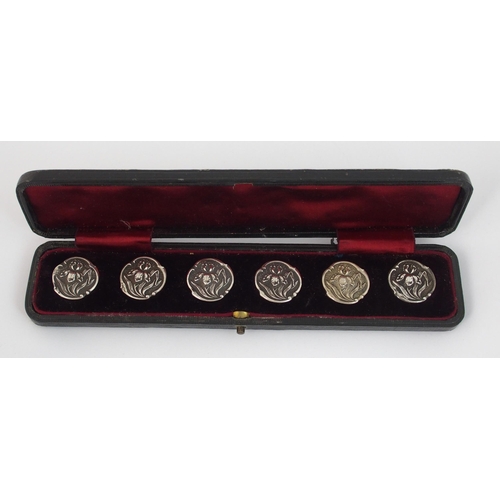 210 - A cased set of six Art Nouveau silver buttons