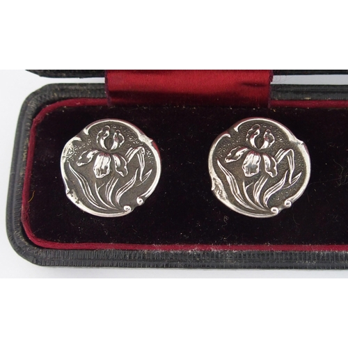 210 - A cased set of six Art Nouveau silver buttons