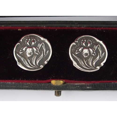 210 - A cased set of six Art Nouveau silver buttons