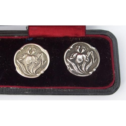 210 - A cased set of six Art Nouveau silver buttons