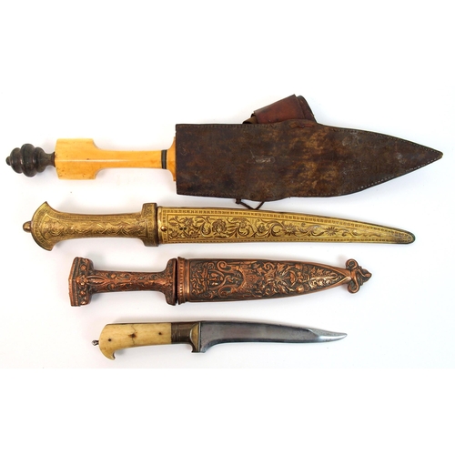 275 - An Eastern dagger with gilt metal hilt