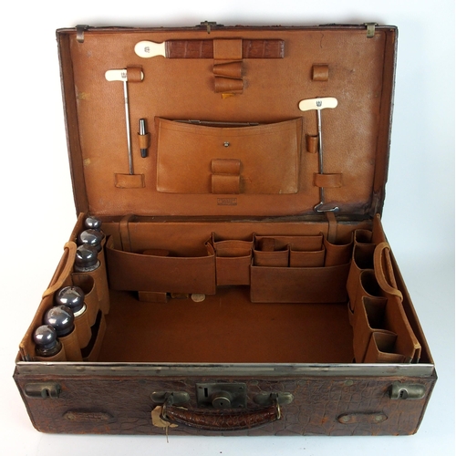 296 - A Victorian crocodile fitted gentleman's suitcase