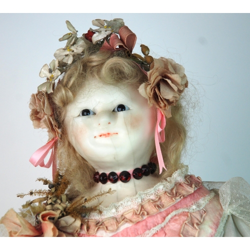 358 - A large wax-headed doll