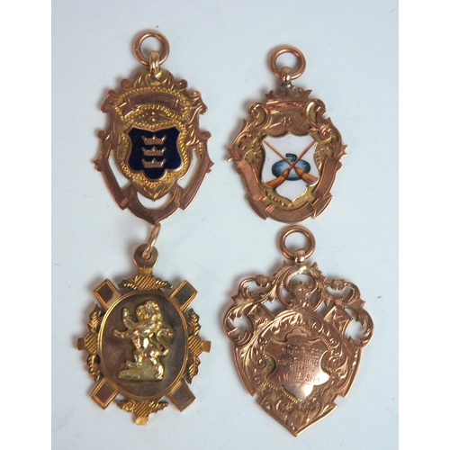 391 - Four various 9ct gold sporting medals