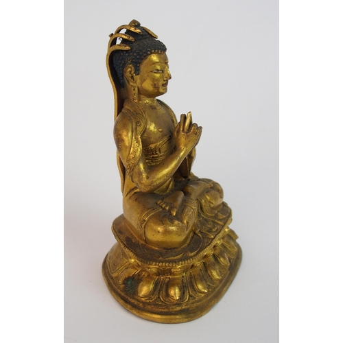 62 - A Sino-Tibetan gilt bronze model of Buddha