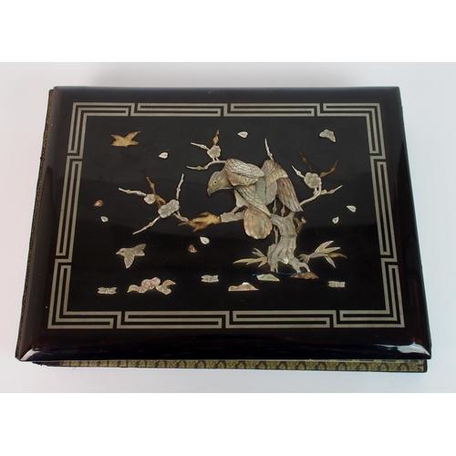 69 - A Chinese black lacquered photograph album