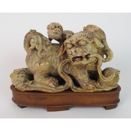 70 - A Chinese alabaster carved model of a buddhistic lion and cubs