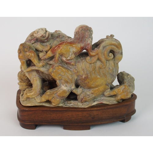 70 - A Chinese alabaster carved model of a buddhistic lion and cubs