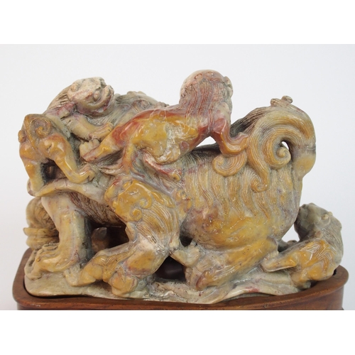 70 - A Chinese alabaster carved model of a buddhistic lion and cubs