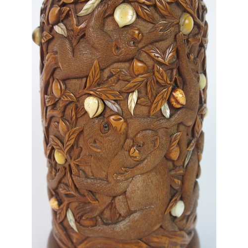 71 - A Japanese carved wood spill vase