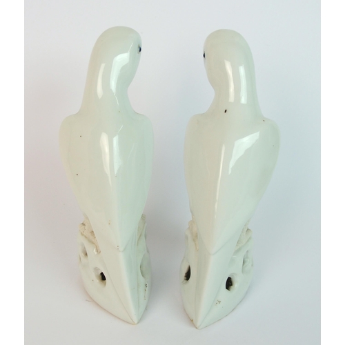 78 - A pair of Chinese white glazed models of birds