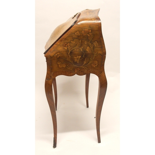 790 - A Louis XV walnut marquetry bombe writing desk