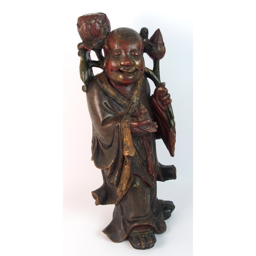 85 - A Chinese carved and painted wood model of a sage