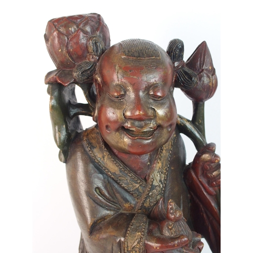 85 - A Chinese carved and painted wood model of a sage