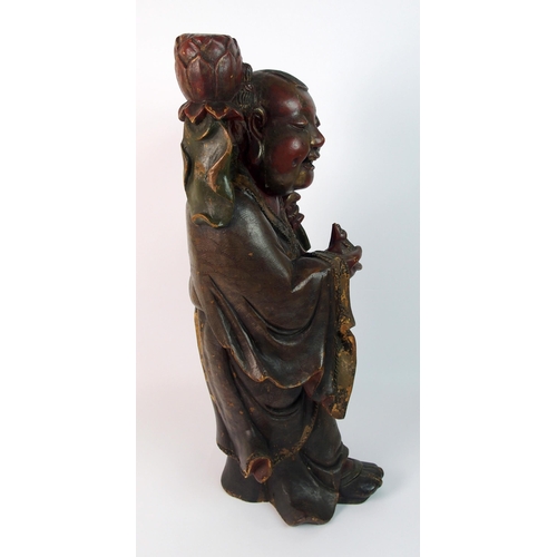 85 - A Chinese carved and painted wood model of a sage