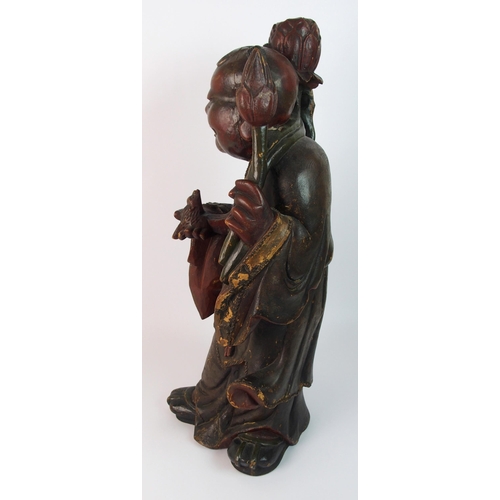 85 - A Chinese carved and painted wood model of a sage