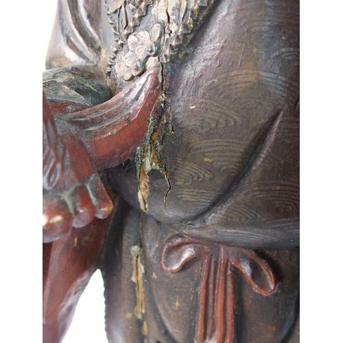 85 - A Chinese carved and painted wood model of a sage