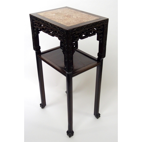 869 - A Chinese hardwood pedestal plant stand