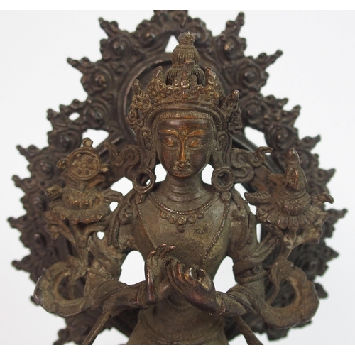 88 - A Sino Tibetan bronze model of a Buddhistic figure